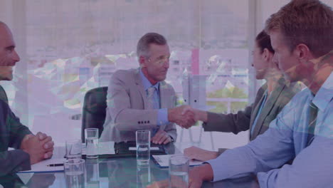 business professionals shaking hands over geometric pattern animation in office