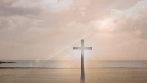 animation of shining lights over crucifix and seascape