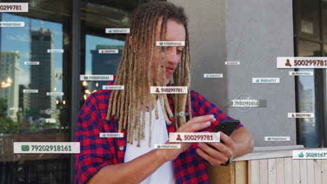 Animation of social media icons with numbers over biracial man using smartphone