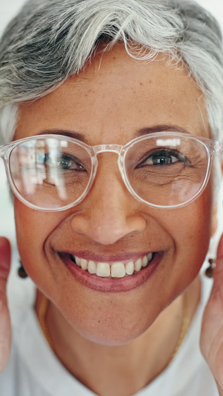 Close-up of a smiling woman wearing glasses