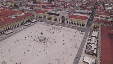 aerial pullback from commerce square revealing lisbon cityscape by the tagus river