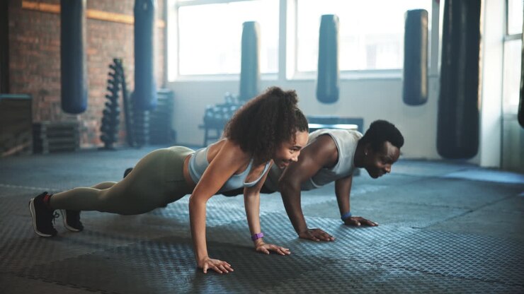 People, high five and push up in gym for fitness