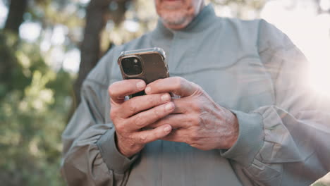 older man using a smartphone outdoors