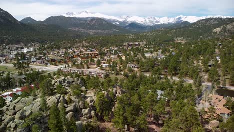 aerial view of estes park, colorado town with large rocks and boulers and mountains in background