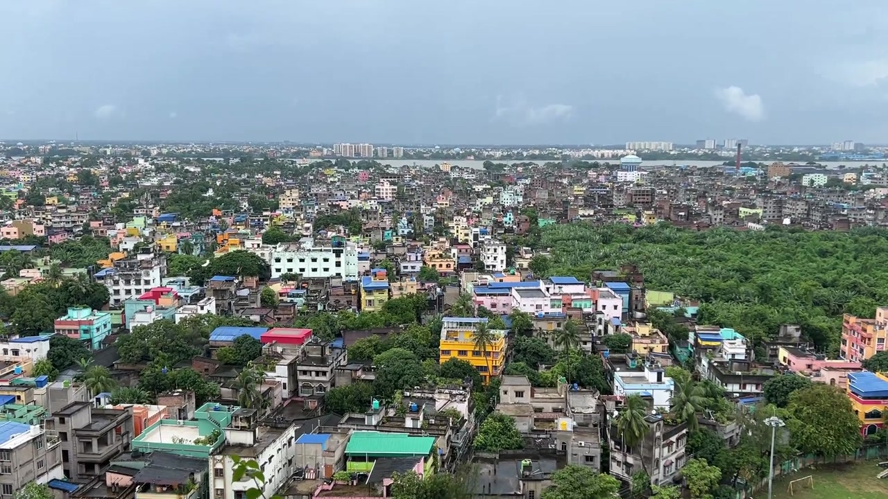 Top aerial shot of Kolkata with river Hoogly flowing at a distance