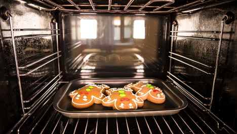 baking gingerbread man in the oven. cooking in the oven.