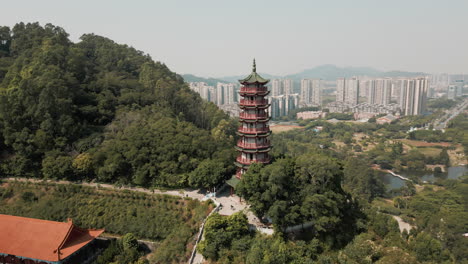 Explore Nansha Tin Hau Palace&#039;s divine beauty with an aerial orbit shot of the goddess statue in China