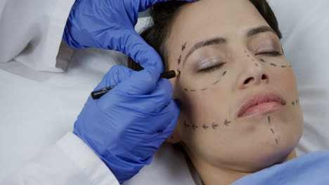 patient and surgeon during a cosmetic procedure