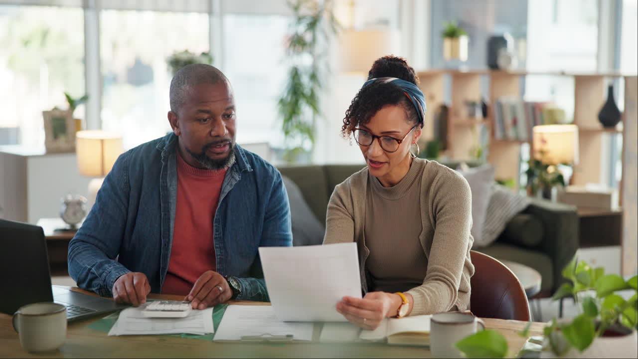 Couple working on finances at home