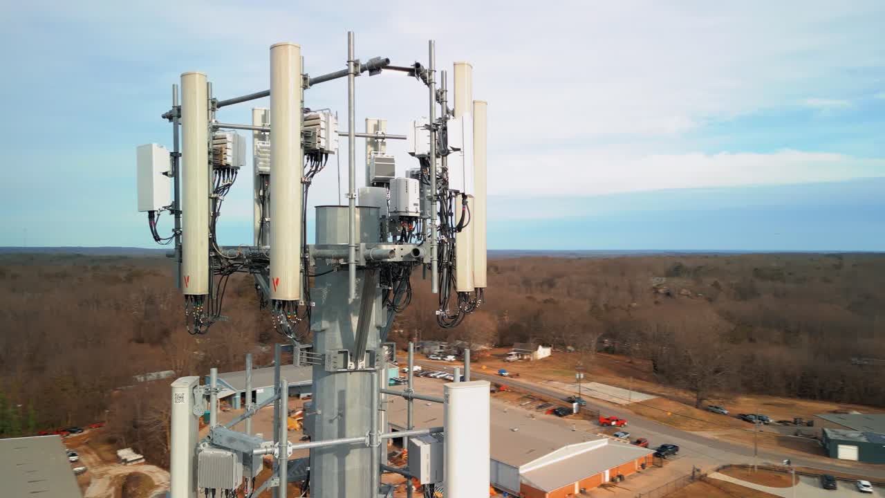 Aerial Shot Revolving Around Cell Phone Tower in Forest. Close Up