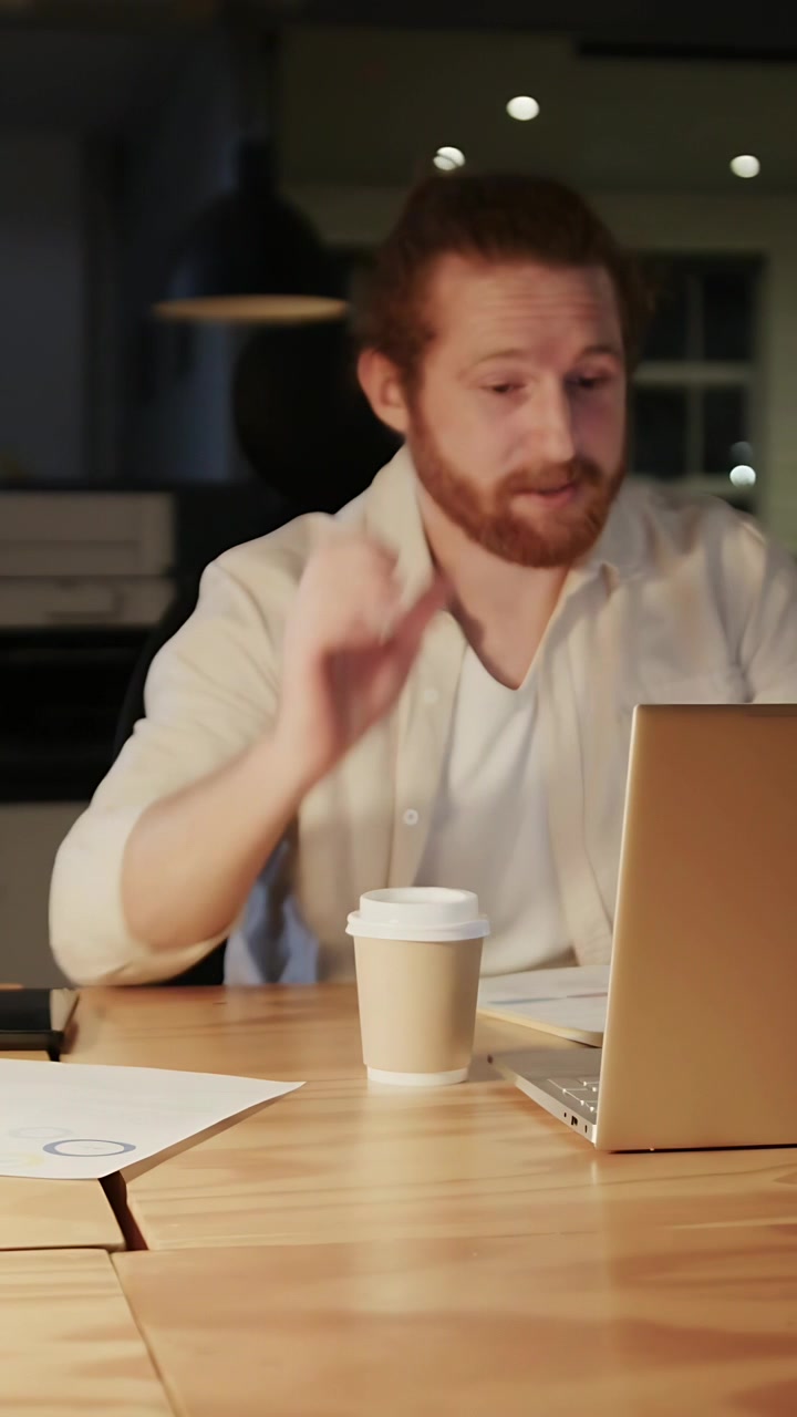 Vertical video: Man laptop typing in business causing heart icons growing over view while focusing