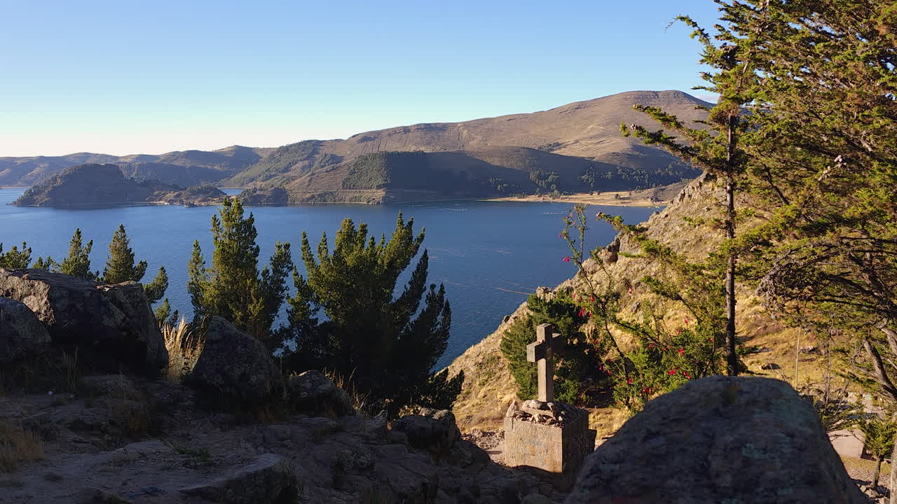 Experience an incredible panoramic view of Lake Titicaca from the top of Cerro Calvario in Copacabana, Bolivia
