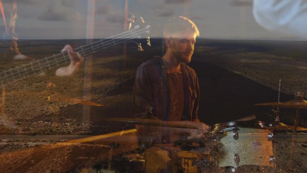Drummer rising after snare hit, striking drums while hands overlay coast, fusing music and scene