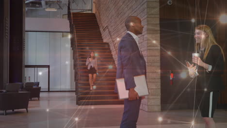animation of network of connections over diverse businessman and businesswoman discussing at office