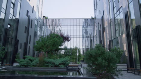 modern glass building exterior. panorama windows reflecting clear sky in morning