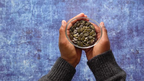 pumpkin seeds in hands