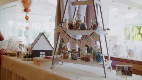 selfmade candy bar at wedding with colourful candy in glases