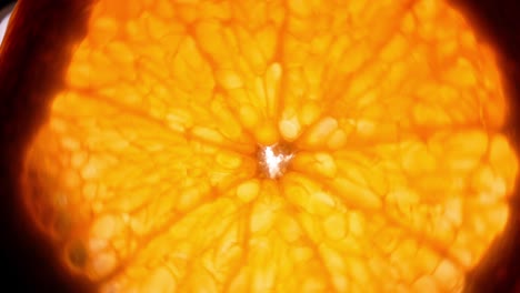 top view rotate of orange slice on white background, close up transparent orange sliced abstract background.