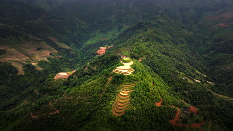 arcing aerial view of mau due terraced rice paddies on mountainside vietnam