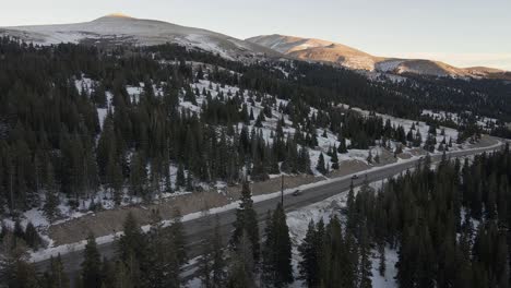 aerial flight following the traffic of highway 9 at sunset with mt