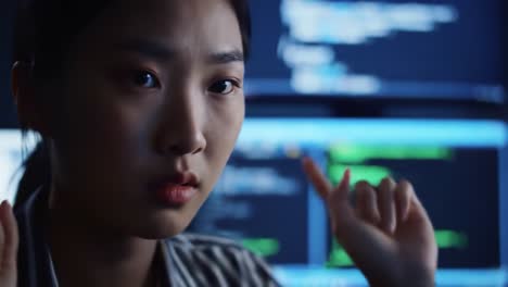 a focused individual analyzes complex data on multiple screens in a dimly lit environment, illustrating the intricacies of technology and problem solving