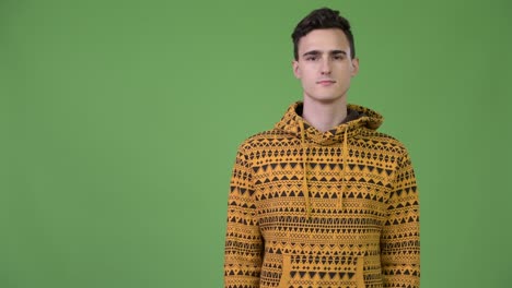young handsome man showing something