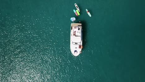 Boat-with-surfboards,-filmed-with-a-drone