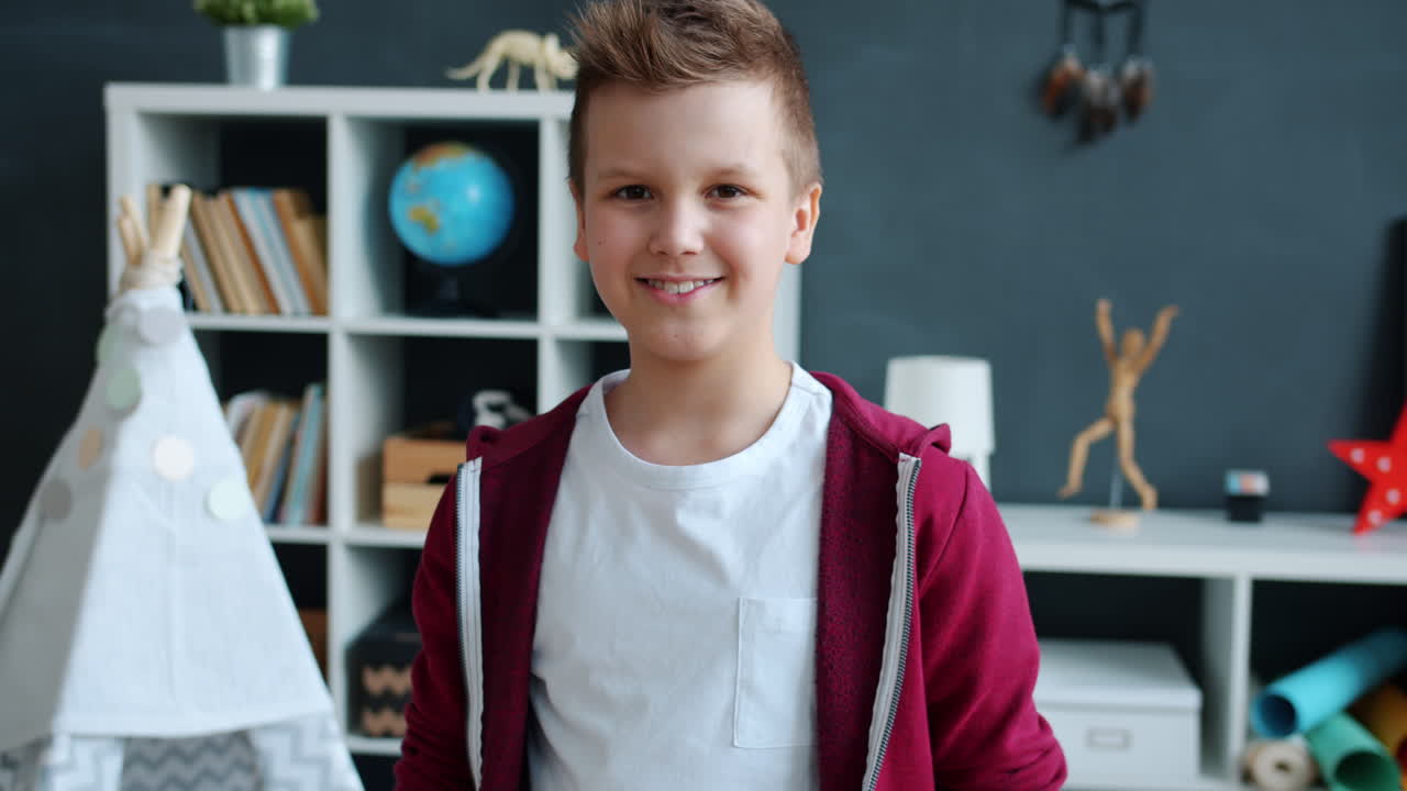 Boy Waving in Playroom