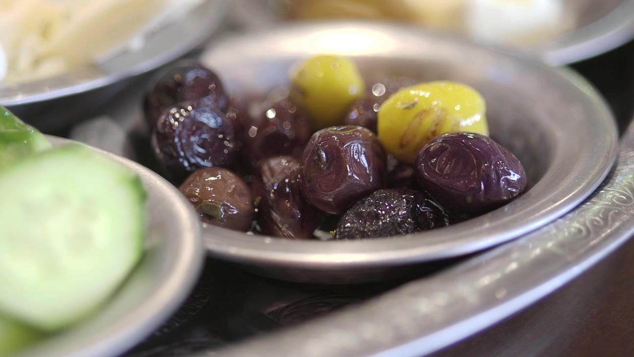 Close-up of Black and Green Olives in a Small Metal Bowl