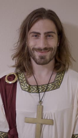 man in religious costume with a cross