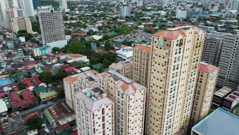 Residential-Homes-and-High-Rise-Condo-Buildings-in-West-Crame,-Quezon-City,-Manila,-Philippines-Aerial-View