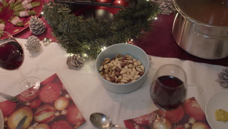 christmas dinner, bowl with nuts, handheld, wide