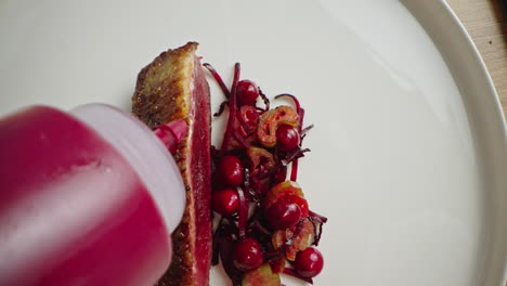 duck breast with cranberry sauce and beetroot