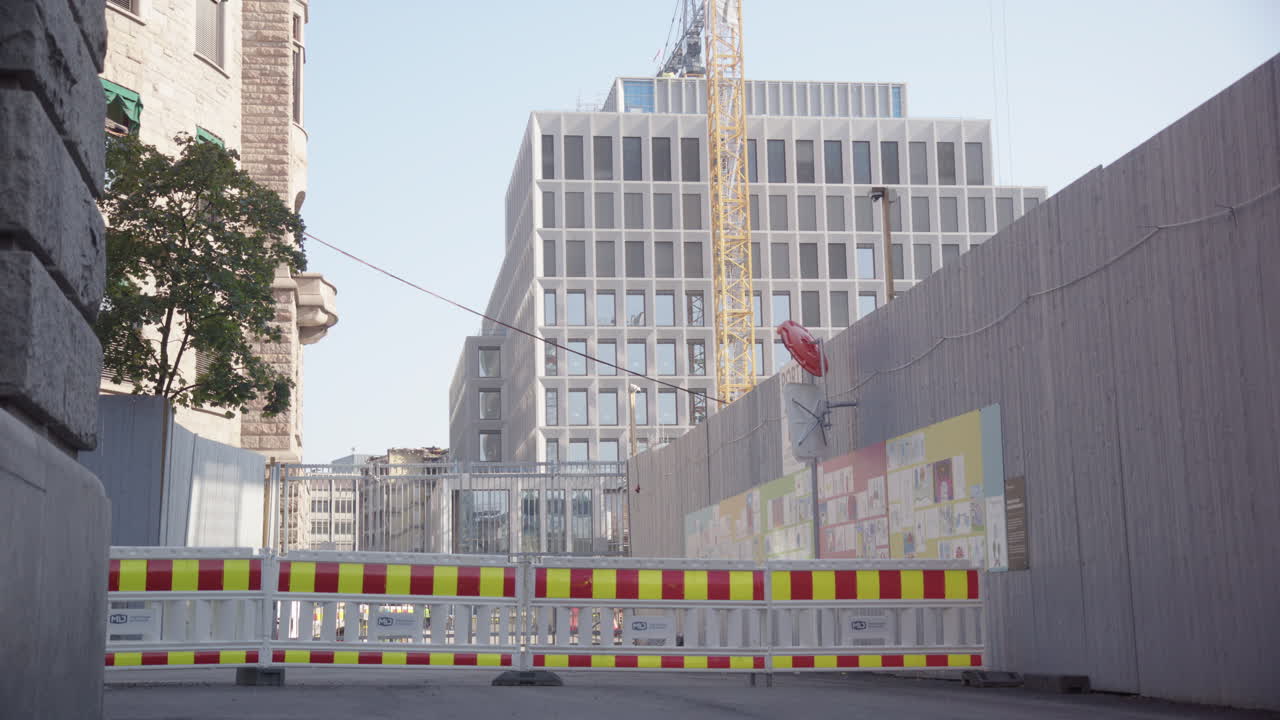 Urban construction site with modern and old buildings