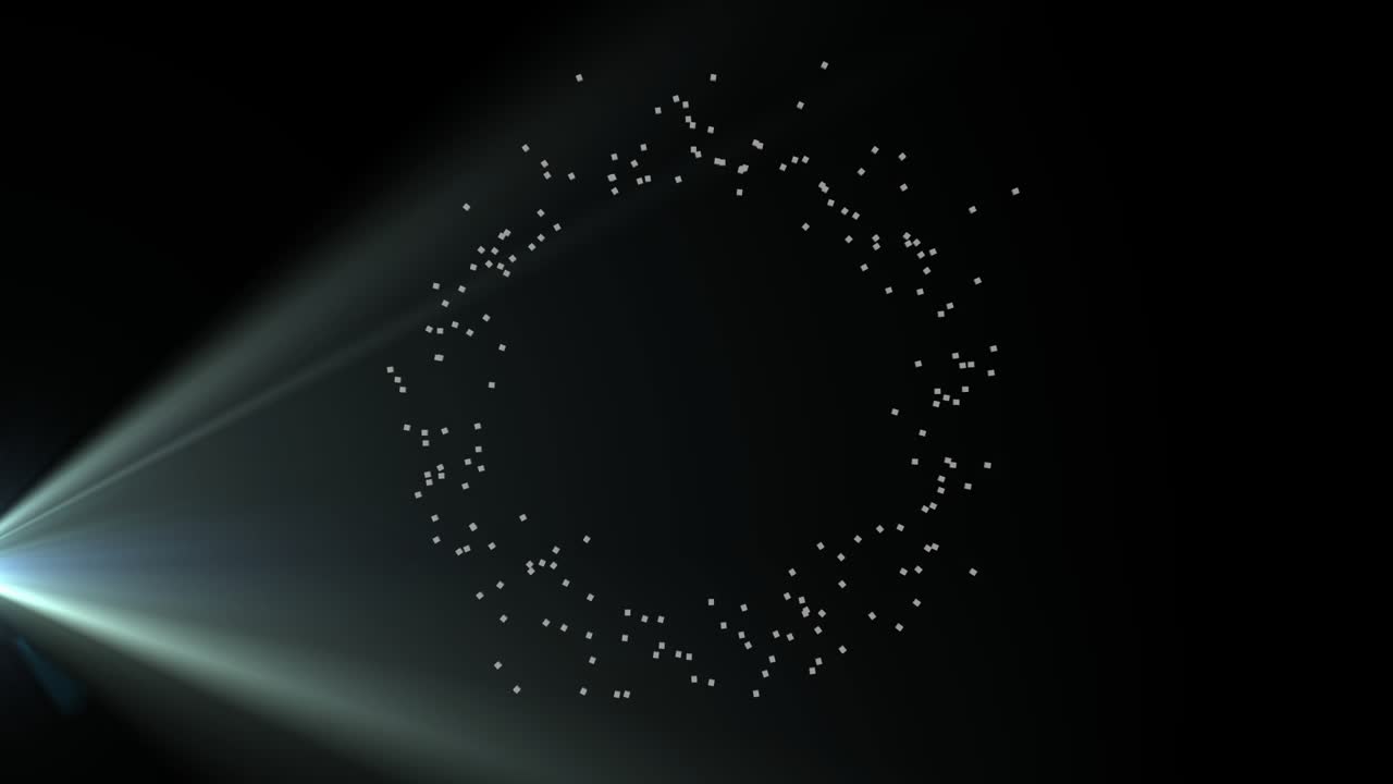 Projector casting pale beams, ring particles moving along circular path, forming clearer ring