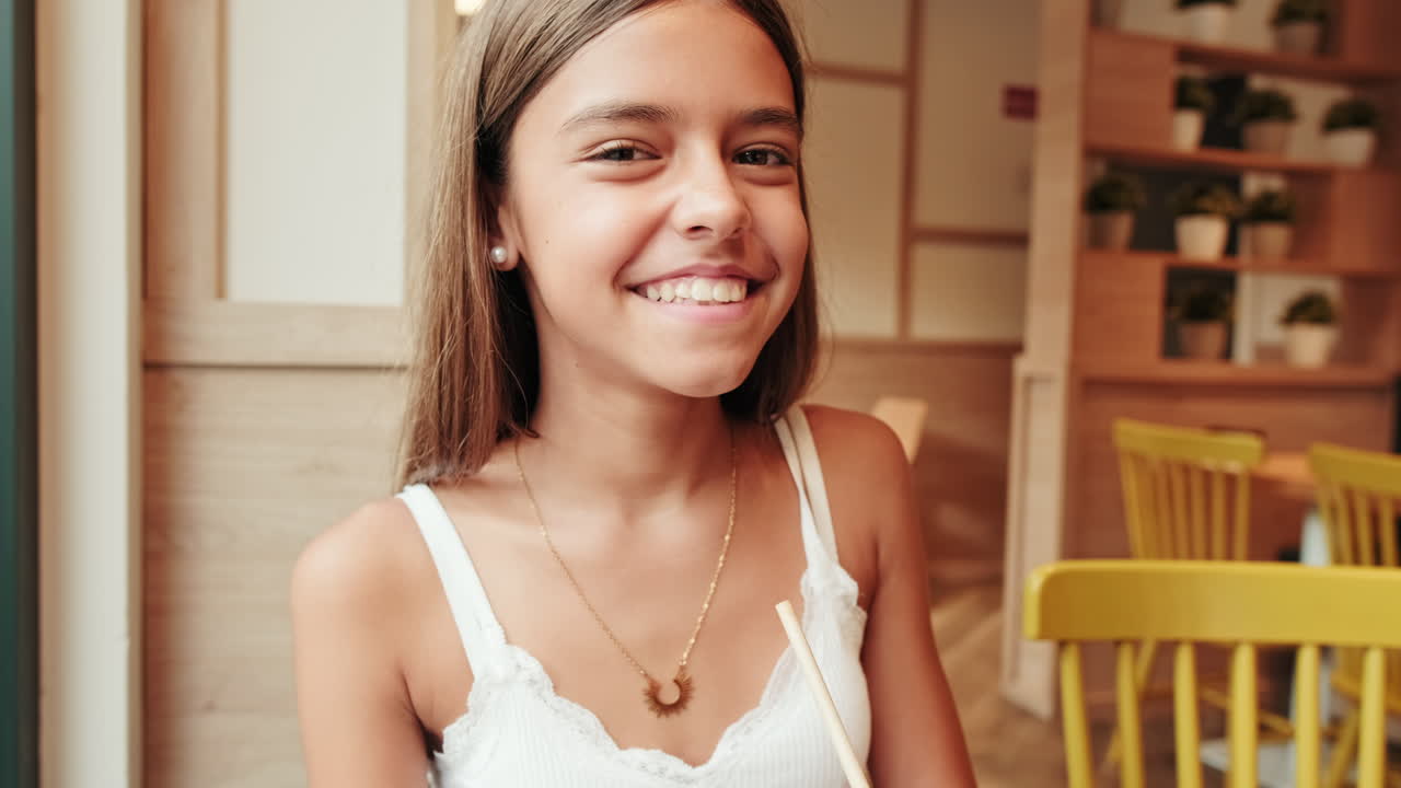 Happy Mother and Daughter at a Cafe