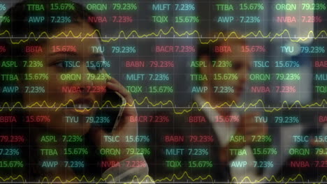 animation of stock market data processing over biracial businesswoman talking on smartphone