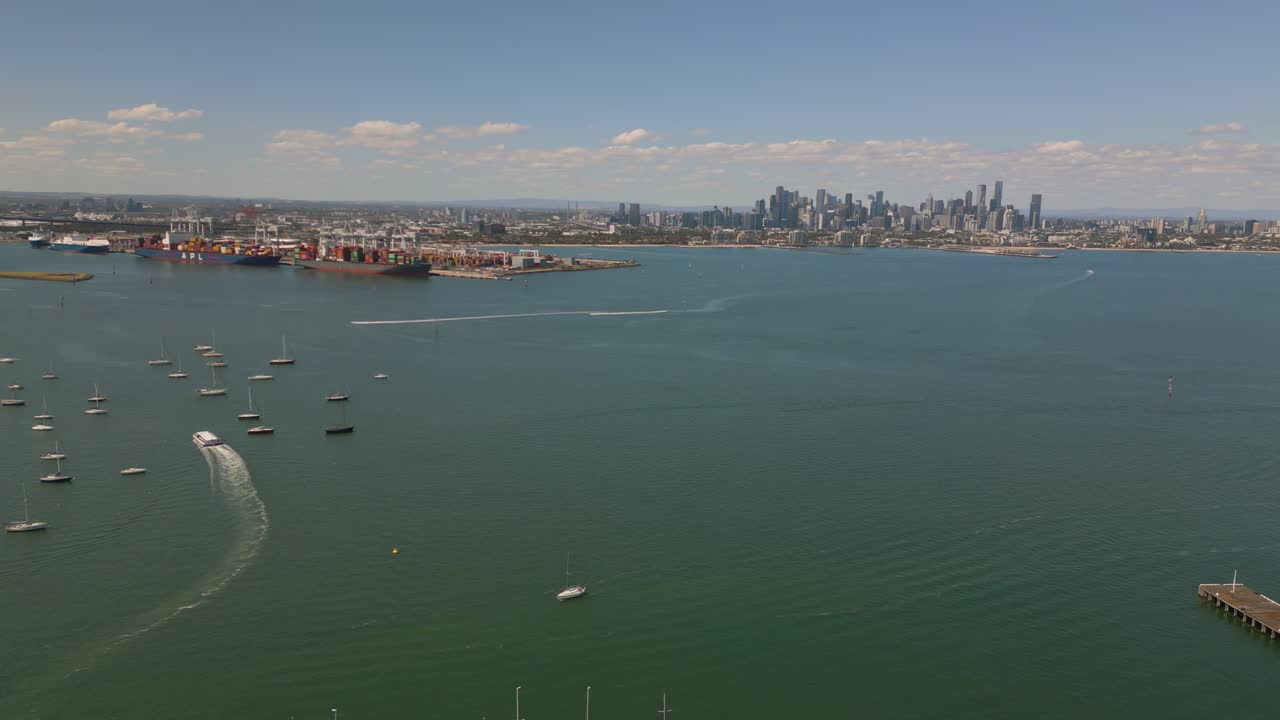 Aerial Footage of Hobsons Bay from Gem Pier in Williamstown, Melbourne. The Melbourne City Skyline can be seen in the horizon.
