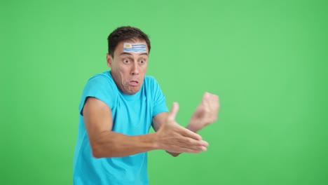 man cheering for uruguay, angry with the decision of referee