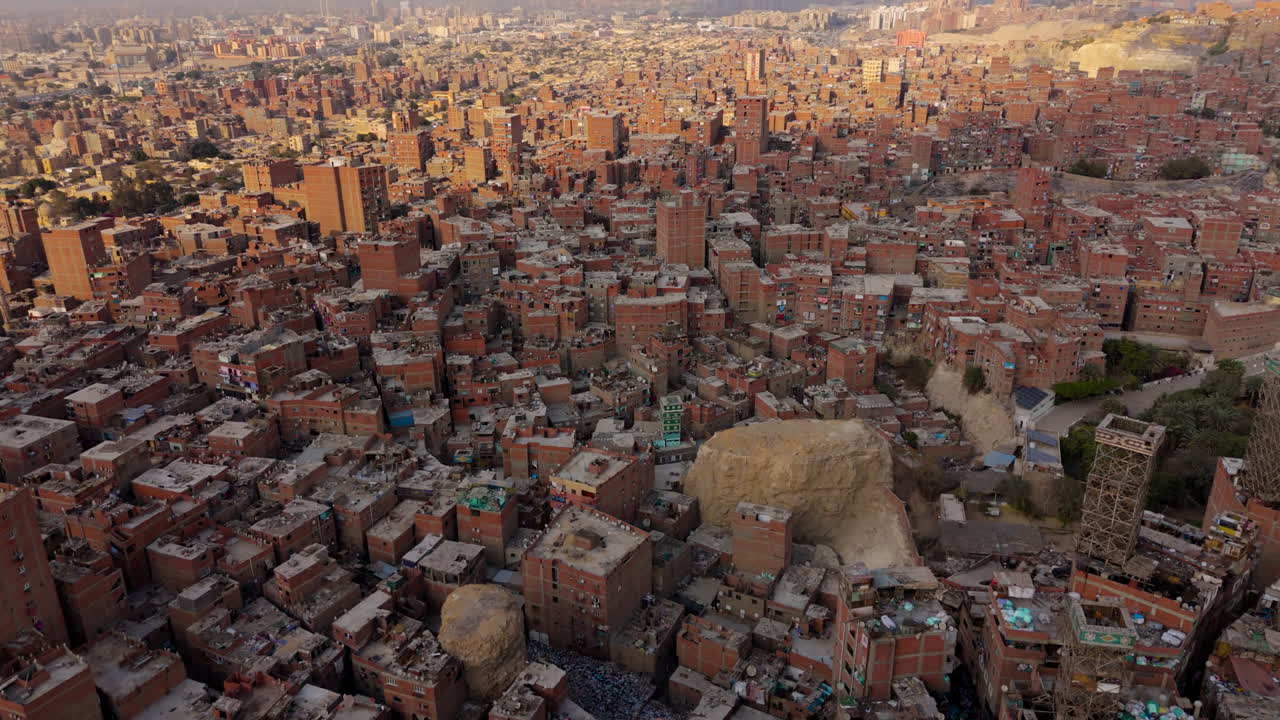 Piles of waste and homes in Zabaleen neighborhood
