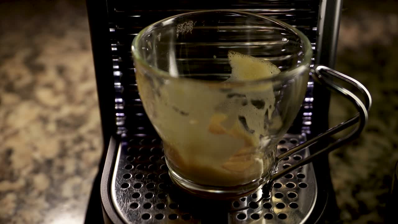 Empty dirty coffee cup illuminated by spotlight. Close up static shot