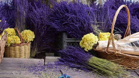 dried lavender and other flowers displayed in baskets