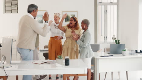 success, high five and winner with business people