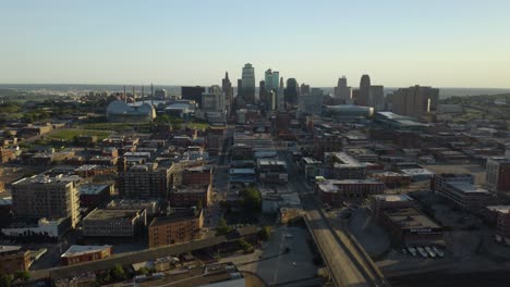 Flying-Away-from-Downtown-Kansas-City,-MO-on-Beautiful-Summer-Morning