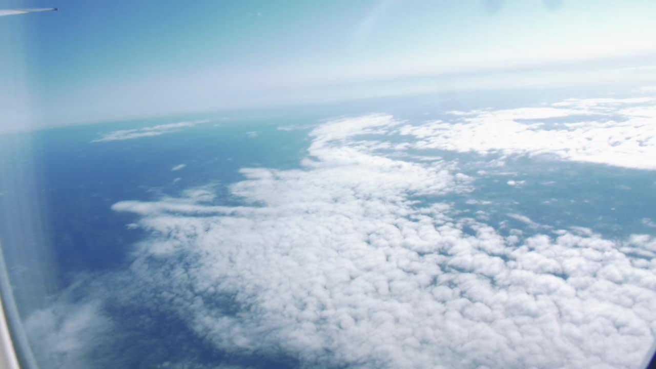 Beautiful Cloud Sky View From Airplane Window Flying From Australia To Singapore - aerial, POV