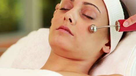 pretty brunette getting micro dermabrasion treatment