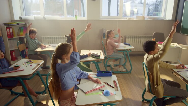 Students studying in school class. Cheerful kids having lesson in auditorium