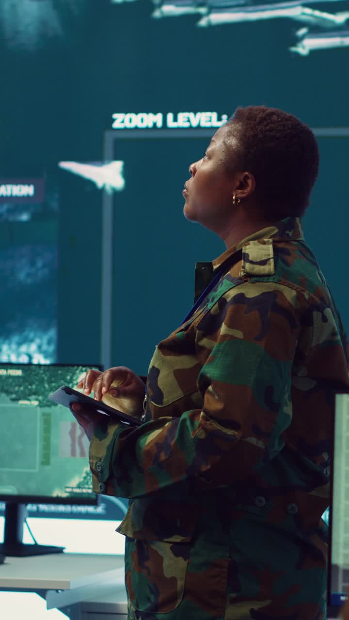 African American Soldier Working in Military Control Room