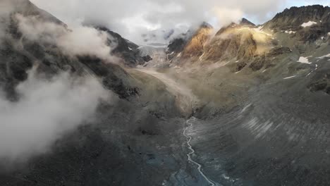 flyover through clouds towards brenay glacier in valais, switzerland