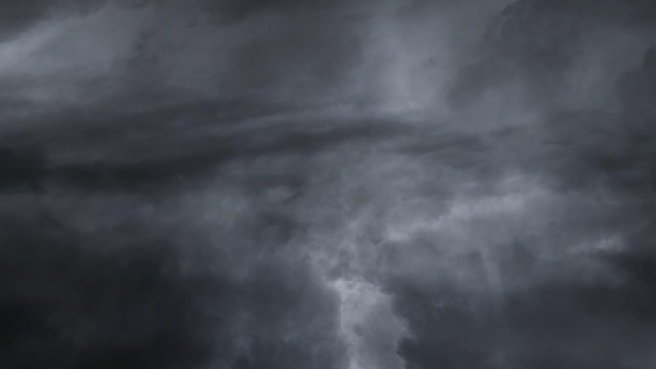 a bolt of lightning on the gray cloud moving from right to left